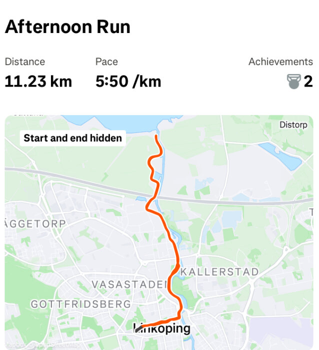 Karta över en löprunda i Linköping, visar en rutt på 11,23 km med snittempo 5:50/km genom staden med start och slut gömda.