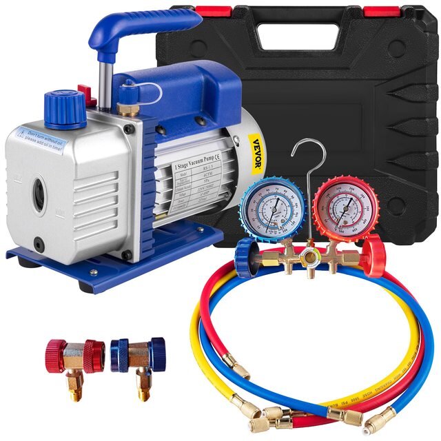 Vakuumpump med manometrar och färgade slangar i förpackning för arbete med bilars AC-system.