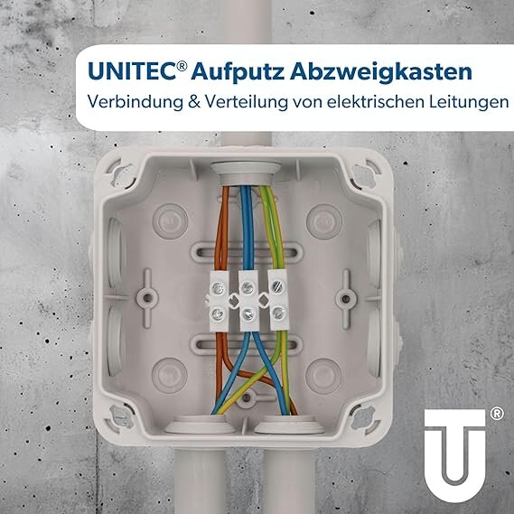 En elektrisk kopplingsdosa med flera färgade kablar anslutna. Märkt med UNITEC, fördelning av elektriska ledningar.