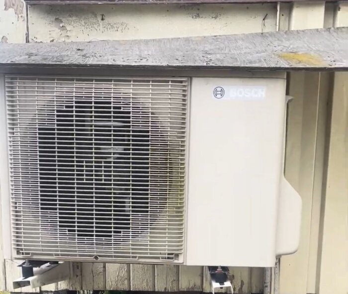 Bosch EHP 6.0-1 AA/O Split air-to-air heat pump mounted on an exterior wall.