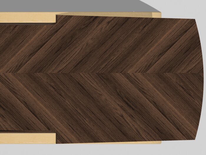 Träbordsskiva med mörkt trämönster, snedställda fibrer. Ljusa träramar synliga vid kanterna.