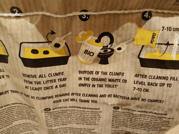 Instruktioner för att rengöra kattlåda, inklusive borttagning av klumpar och användning av biologiskt nedbrytbar kattsand.