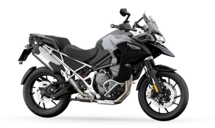 Triumph Tiger 1200 GT motorcykel sedd från sidan med svart och grå färgsättning, touringmodell med robust design.