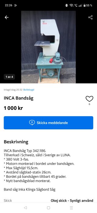INCA bandsåg på ett bord, med en röd el-anslutning och motor. Sågen står framför en svart vägg.