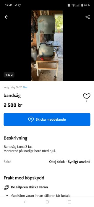Bandsåg Luna monterad på ett bord med hjul i ett garage eller verkstad, med en propangasbehållare bredvid.