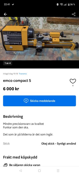 Gul emco compact 5 svarv på ett bord, med en bakgrund av blommigt tapetmönster och träbänk ovanför.