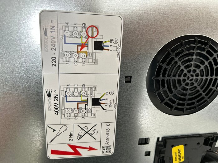 Label on Electrolux induction hob showing wiring diagram for 220-240V 1N and 400V 2N connections, with missing L1 wire indicated.