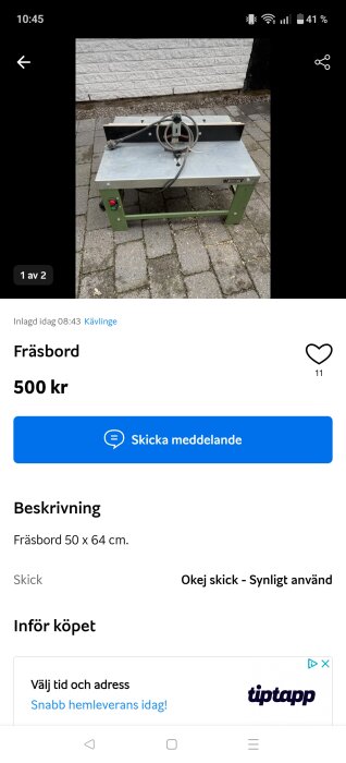 Fräsbord i metall med gröna ben, placerat på en stenlagd yta, visas till salu för 500 kr enligt inlägget.