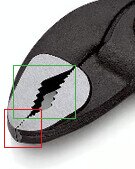 Knipex Cobra tång med markerade vinklade tänder med en grön rektangel och mindre främre gripdel markerad med en röd rektangel.