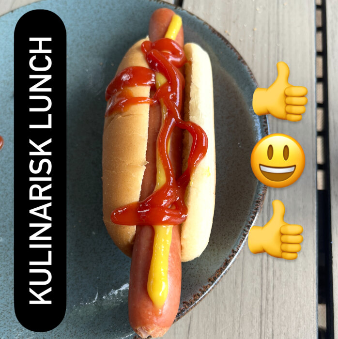 Wienerkorv i bröd med kreativt mönster av ketchup och senap, med texten "Kulinarisk lunch" och glada emojis.