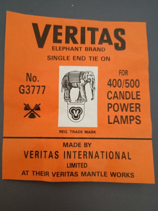 Etikett från Veritas märkt "Elephant Brand", för 400/500 candle power lampor, modell G3777, med en elefantillustration och tillverkad av Veritas International.