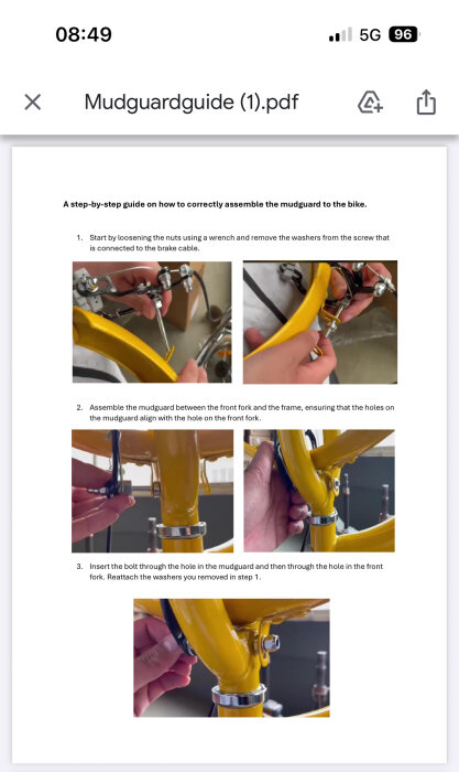 Guide för att montera stänkskärm på cykel, släppa muttrar med skiftnyckel, justera skärm mellan framgaffel och ram, sätta i bulten och återställa brickor.