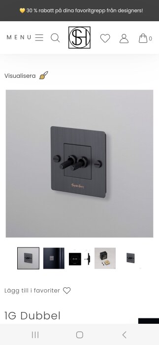 Designad strömbrytare med dubbla spakar i mörkt material monterad på en vägg, erbjuder ett estetiskt avvikande alternativ.