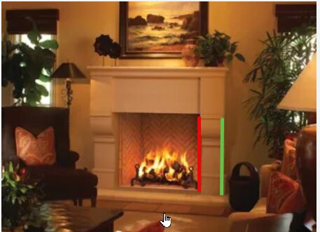 Öppen spis i vardagsrum med eld, röda och gröna markeringar på spishärden för att visa mätpunkter mellan inner- och yttervägg.