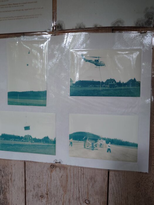 Fyra gamla fotografier visar en helikopter som lyfter byggmaterial i en öppen fältmiljö med människor som hjälper till på marken.