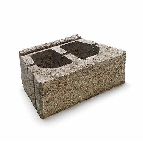 Murblock med dubbelhål, låsklack och mått 435×270×150 mm, används för att bygga murar runt parkeringsytor.