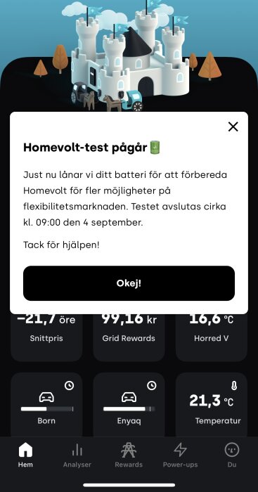 Homevolt-test popup med ett slott ovanpå, omgiven av bilar och träd, visar meddelande om batterilån för flexibilitetsmarknaden.
