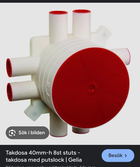 Takdosa med rött lock och åtta anslutningar, används för rördragning på vindar.