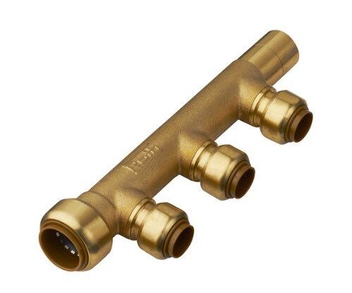 Guldfärgad koppling med flera anslutningar, troligen en TecTite-koppling, som pekar nedåt.