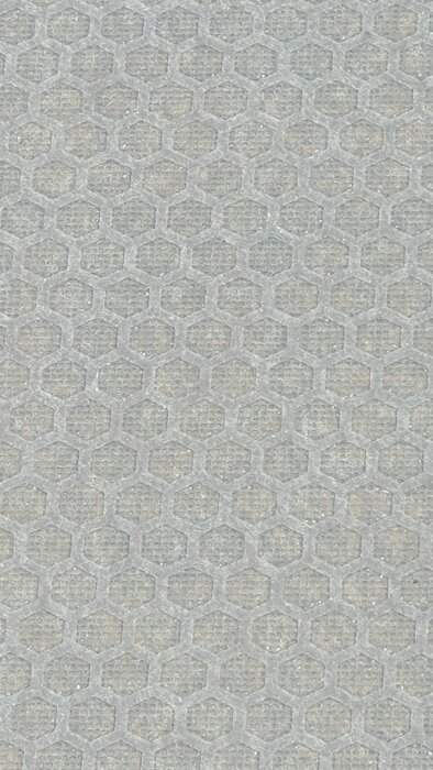 Närbild av en skiva med hexagonalt mönster, eventuellt en del av en konstruktion för ett släp.