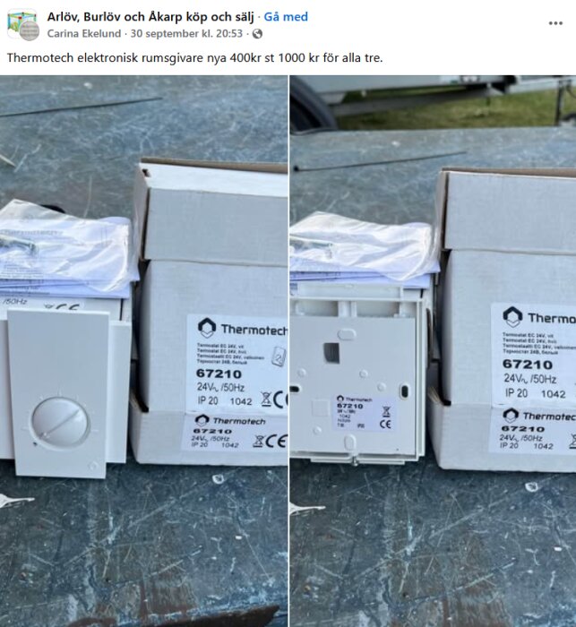 Tre Thermotech elektroniska rumstermostater modell 67210 i originalförpackning, med märkning och manualer, placerade på ett bord utomhus.