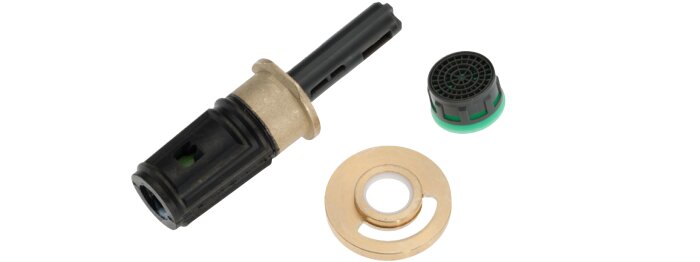 Tre rördelar: en svart plastcylinder, en grön-svart ventilinsats och en guldfärgad metallbricka med hål i mitten.