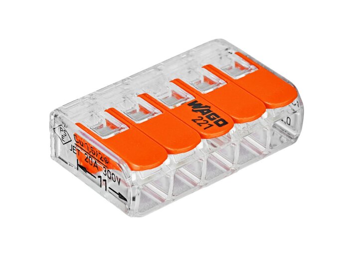 Vid bild ses en Wago 221 kopplingsklämma med fem anslutningar och orangea spakar, används för elektriska anslutningar.