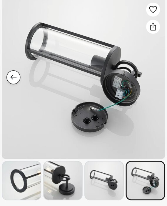 Svart vägglampa med glasrör och avtagbart fäste, elektriska kablar synliga. Lampans höjd med fäste: 45 cm.