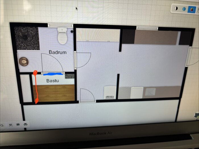 Skiss av källarplan med bastu, blåmarkerad luftinträde under glasdörr och röd markering för luftutgång via ventil till badrum.
