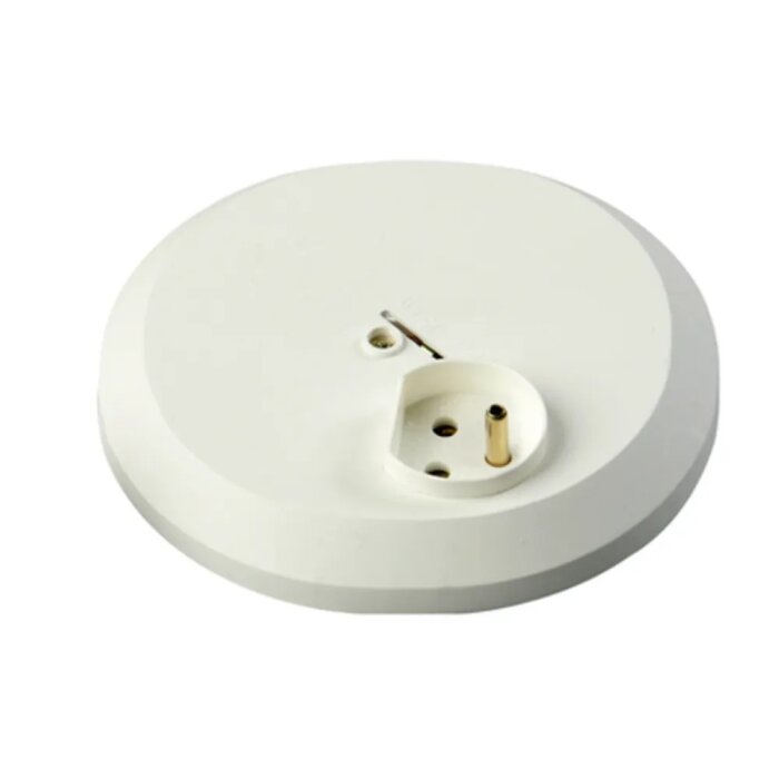 Gammeldags jordat takuttag, vitt med rund form och central placering för stickpropp.