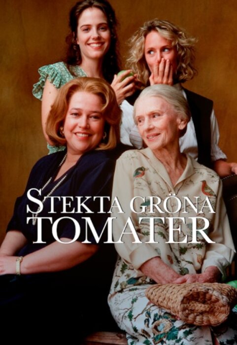 Filmaffisch med fyra kvinnor från "Stekta gröna tomater", två sittande och två stående bakom, med filmens titel över bilden.