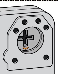 Bild som visar en låsmekanism med skruvhål och ett centralt krysspår, samt en orange pil.