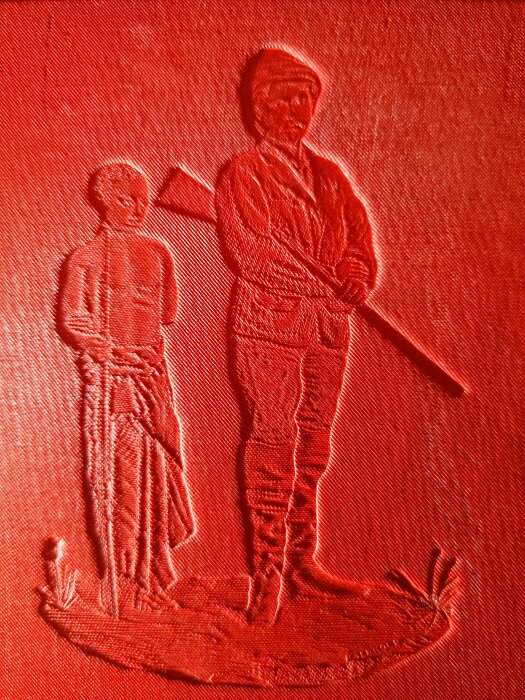 Relief av två personer på en bokrygg, av Henry Morton Stanleys verk från 1878.