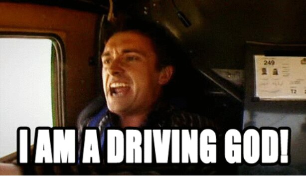 En person i en bil ropar entusiastiskt med texten "I AM A DRIVING GOD!" över bilden.