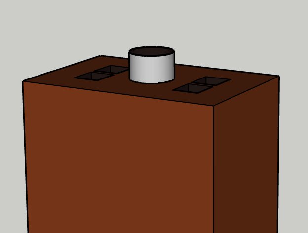 Brun låda med fyra ventilationskanaler ovanpå och ett vertikalt rör i mitten, del av diskussion om braskamin och ventilationslösningar.