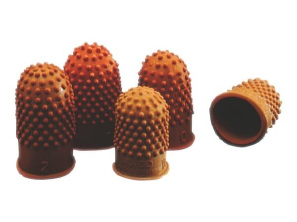 Flera gummituttar med knottrig yta placerade tillsammans på en vit bakgrund.