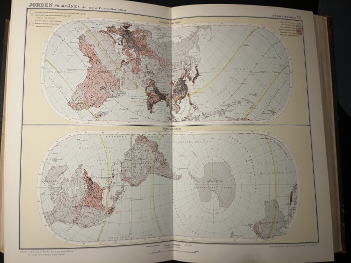 Karta från en kartbok från 1926 som visar "Gamla världen" och "Nya världen" med fokus på befolkningstäthet och geografiska skillnader.