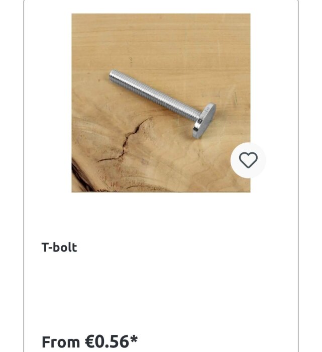 T-bult i metall på en träyta, prisuppgift visas.
