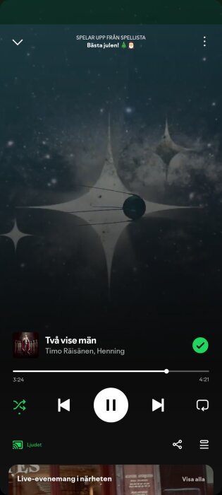 Spotify-spellista "Bästa Julen" spelas, visar låten "Två vise män" av Timo Räisänen och Henning med galaxmotiv i bakgrunden.