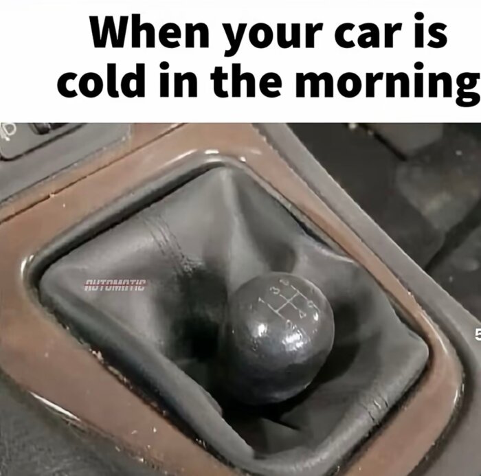 Växelspak i en bil med texten "When your car is cold in the morning" överst.