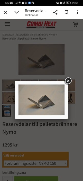 Förbränningsroster för Nymo 150 pelletsbrännare i metall på vit bakgrund.