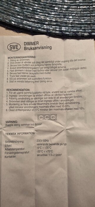 Bild av en bruksanvisning för en dimmer från Bauhaus, med monteringsanvisningar och teknisk information om strömförsörjning och driftstemperatur.
