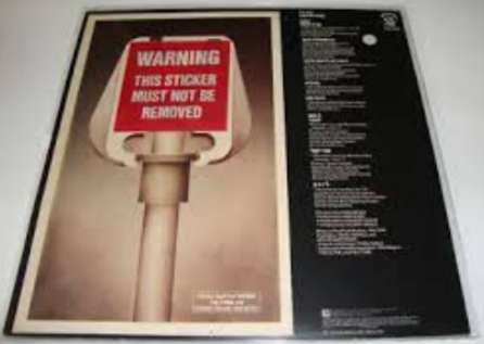 En bild av albumomslaget till Hawkwinds "PXR5" med en varningssticker som säger "WARNING THIS STICKER MUST NOT BE REMOVED".