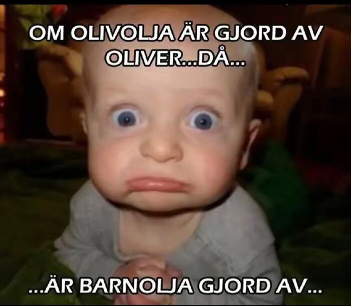 Ung bebis med överraskat ansiktsuttryck och texten "Om olivolja är gjord av oliver...då... är barnolja gjord av...".