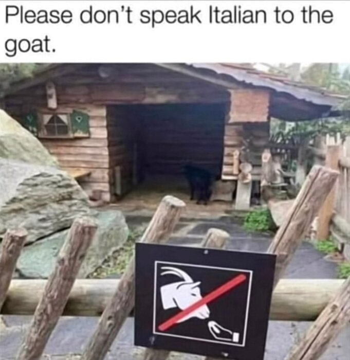 Get och skylt med "mata ej" vid en liten timmerstuga, text ovanför: "Please don’t speak Italian to the goat.