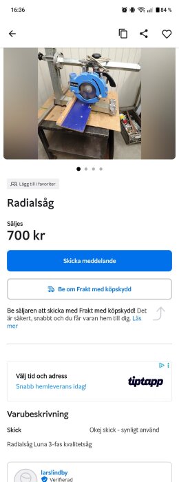 Radialsåg av märket Luna, blå färg, placerad på ett arbetsbord i ett verkstadsutrymme.