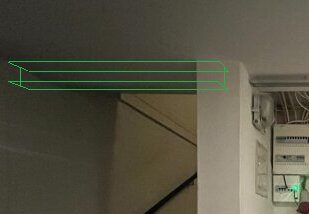 Wall with electrical box and stairway; green lines showing new floor edge.