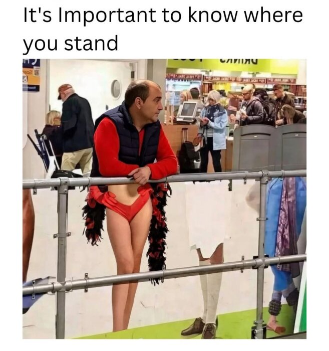 Man lutad mot räcke framför skärmdel, verkar ha kvinnoben och kort kjol, med texten "It's important to know where you stand" ovanför.