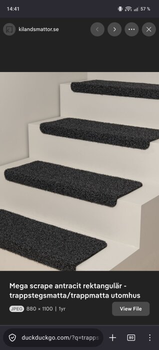 Gray rectangular stair treads on white stairs for indoor use.