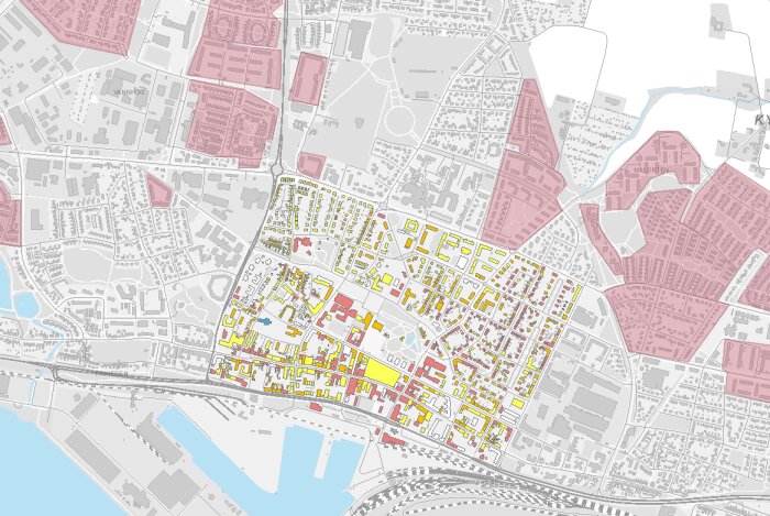 Karta över centrala Trelleborg med markerade områden i olika färger, visar stadsplanen och byggnader.
